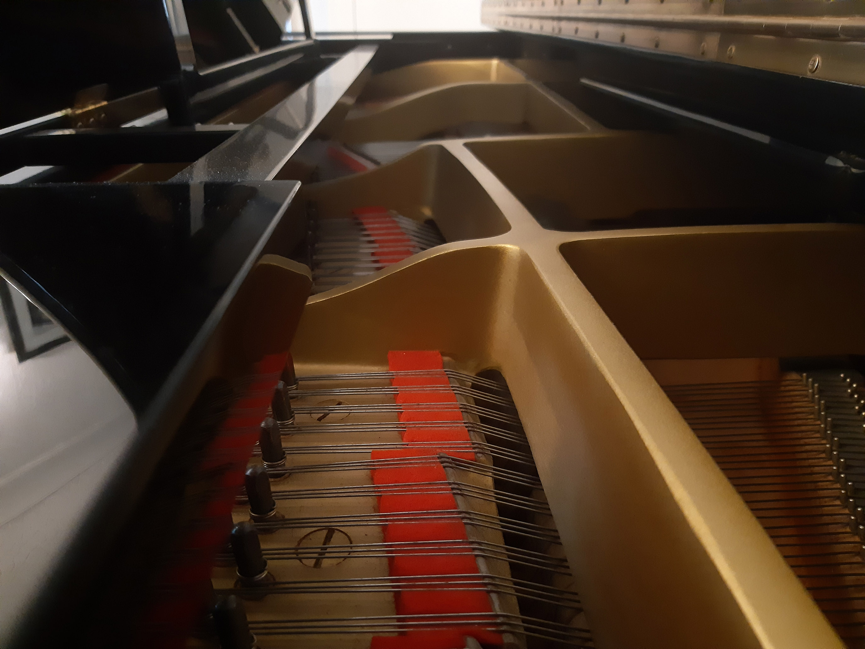 inside the Yamaha grand piano at the Just Piano tuition studio